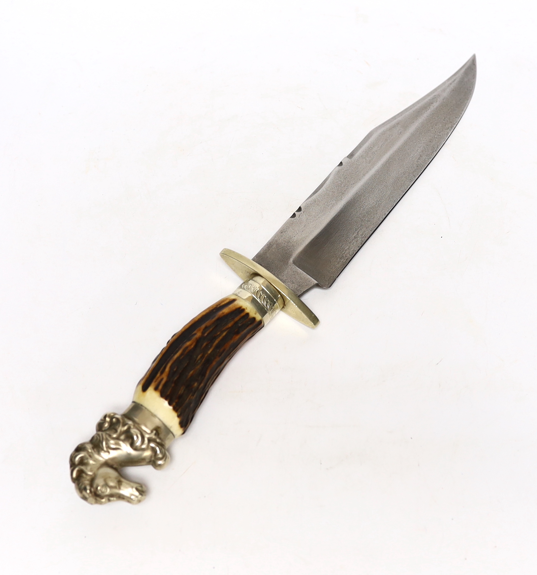 A James & Lowe Bowie knife, clip point blade with unsharpened false edge and decorative filework, stamped James & Lowe Sheffield, with Eagle, Cross and Star marks, stag horn handle with nickel silver guard, and horse-hea